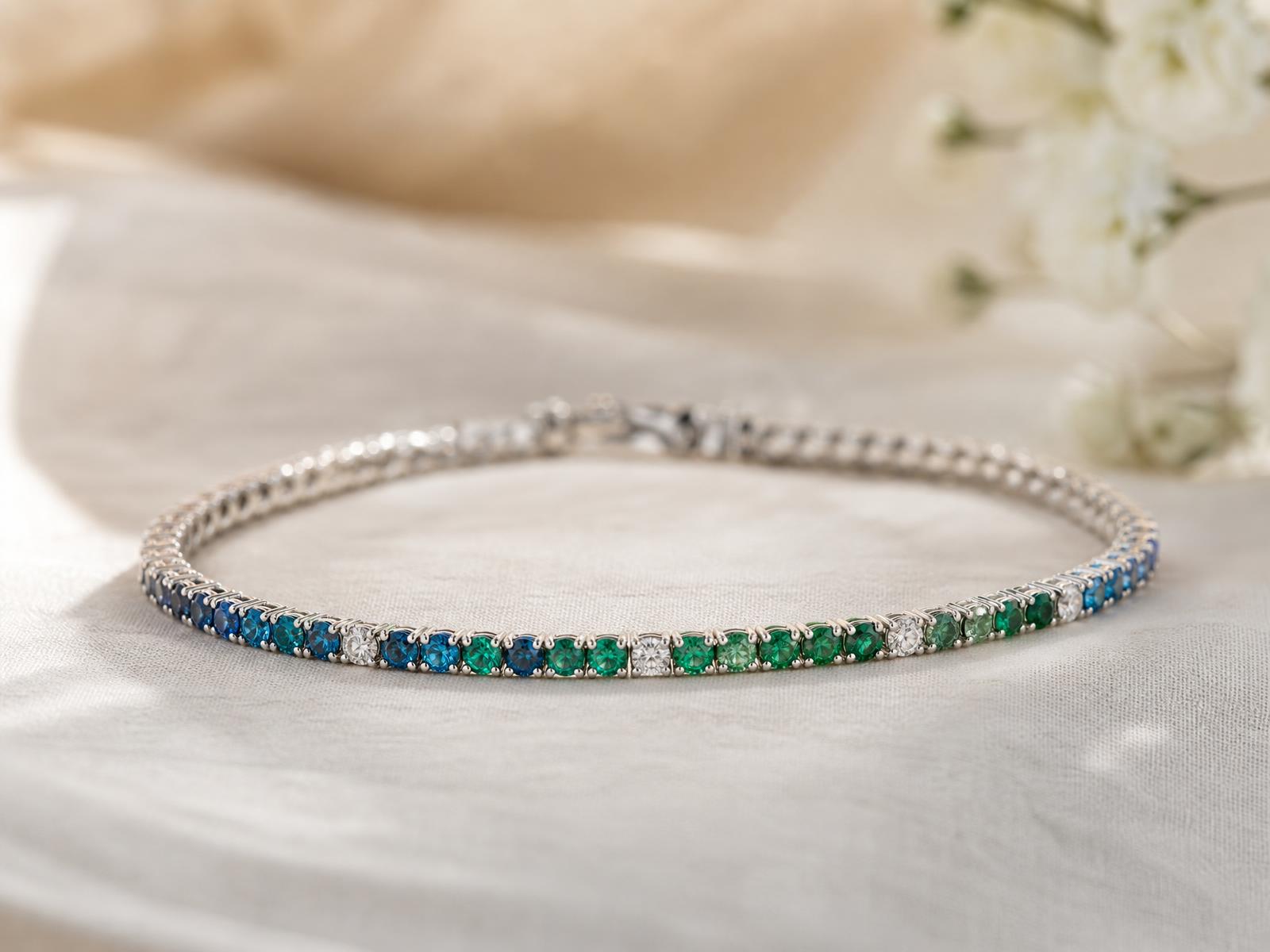 Persephone study tennis bracelet in peacock blue, teal and emerald gemstones